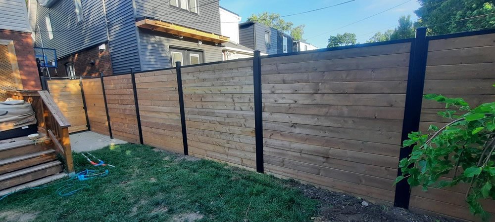 Horizontal wood fence with black steel posts GTA